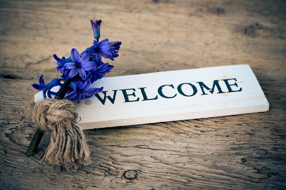 graphic of flowers and welcome text